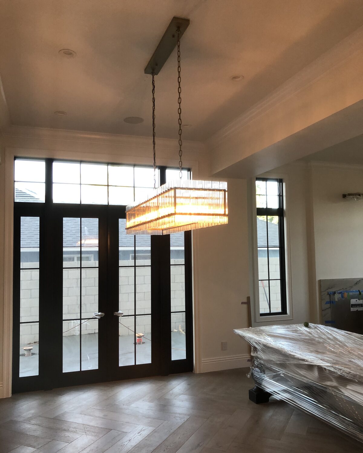 Custom chandelier and entryway lighting installed by RJ Electrical