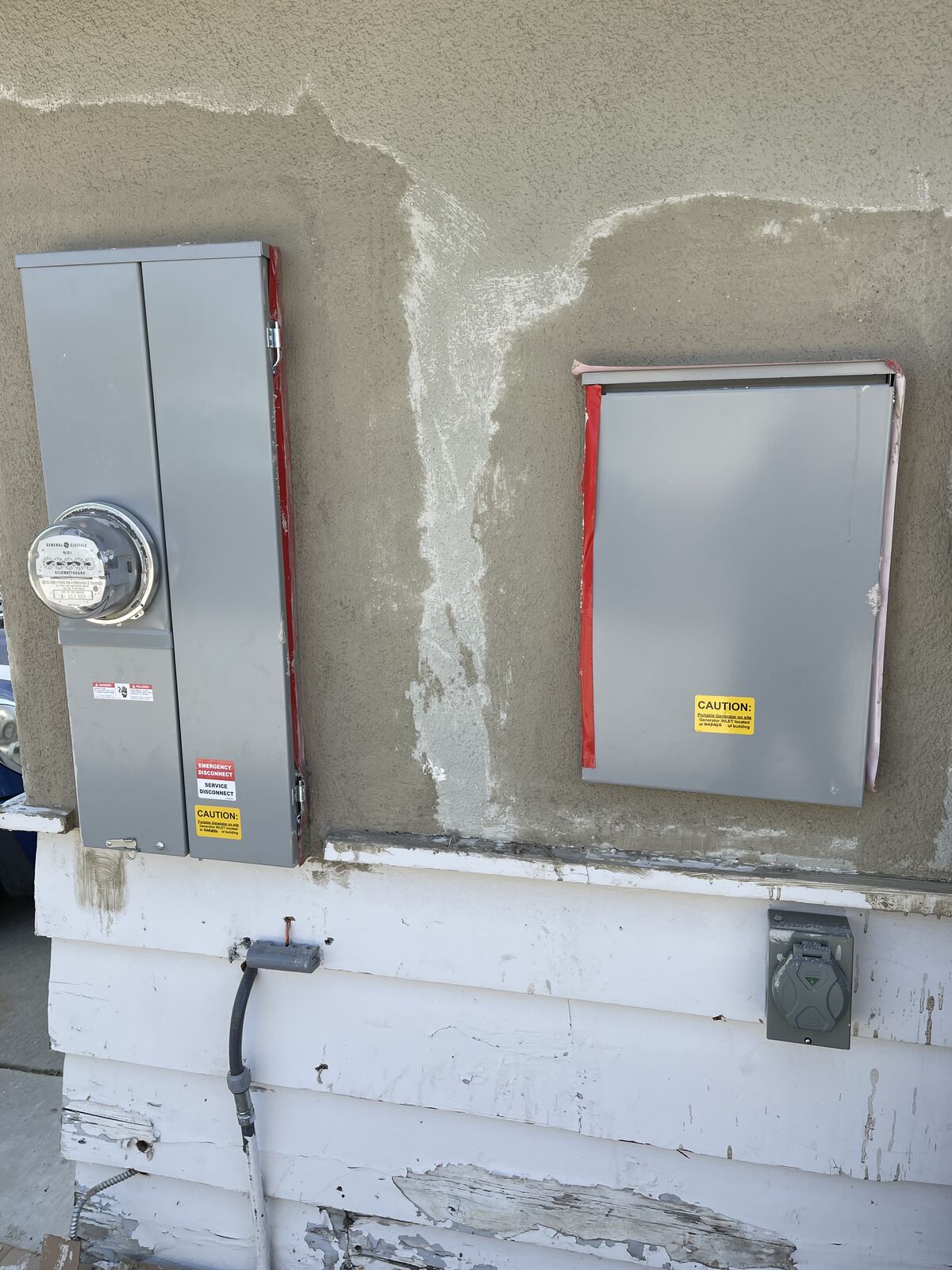 Two new electrical panels installed and finished on a home exterior
