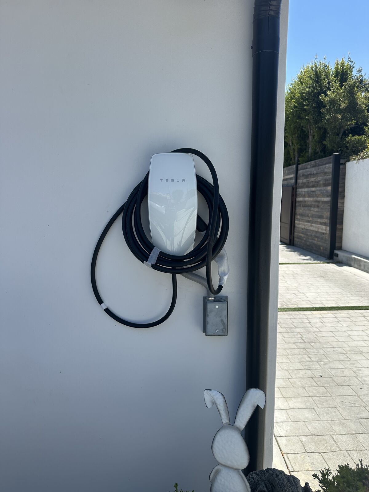 Level 2 EV charger mounted on an exterior wall